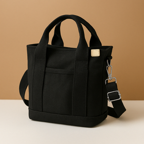 Stylish women’s canvas shoulder bag with adjustable strap, secure zipper, and multiple compartments for everyday essentials