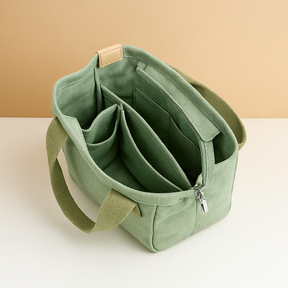Stylish women’s canvas shoulder bag with adjustable strap, secure zipper, and multiple compartments for everyday essentials
